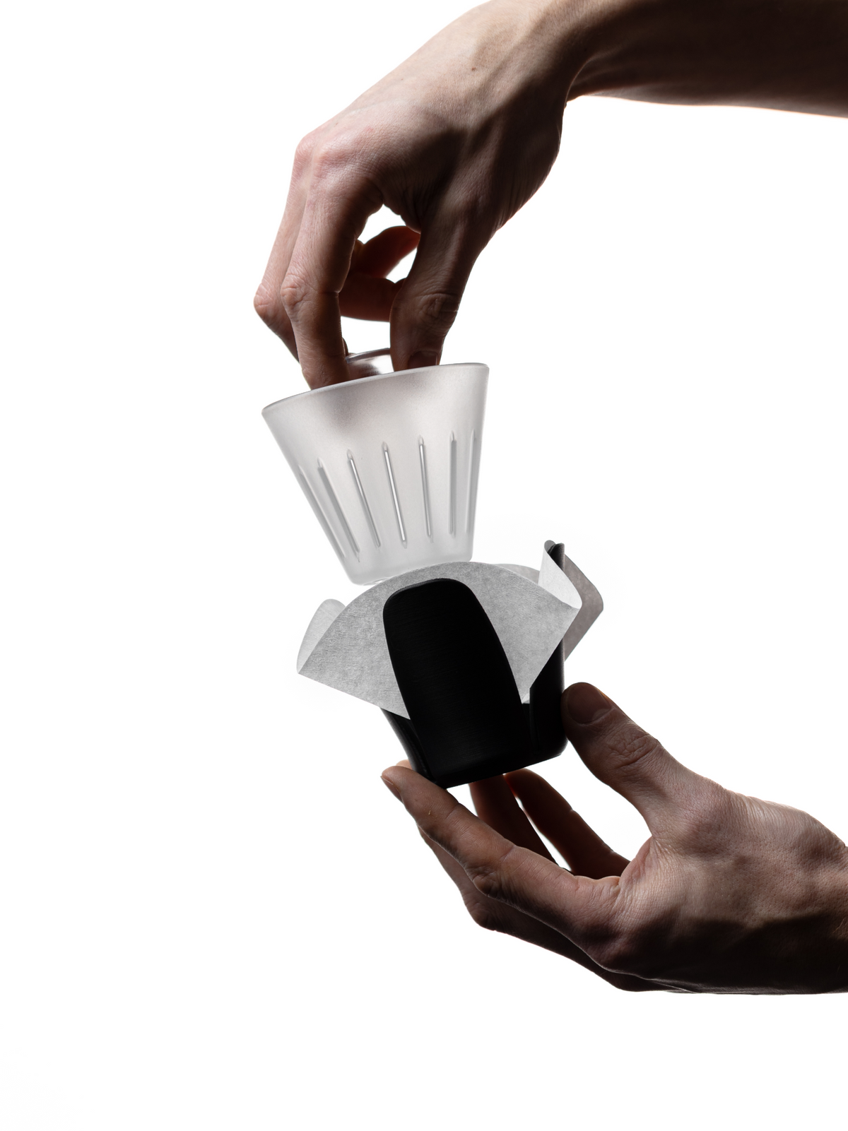Pressing a flat filter into an Orea brewer with the Neo Negotiator