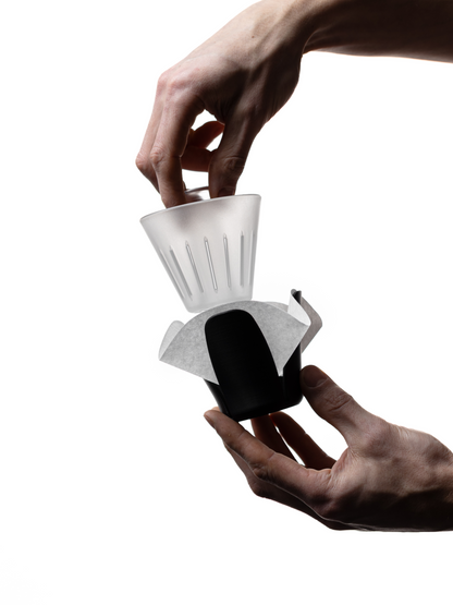 Pressing a flat filter into an Orea brewer with the Neo Negotiator